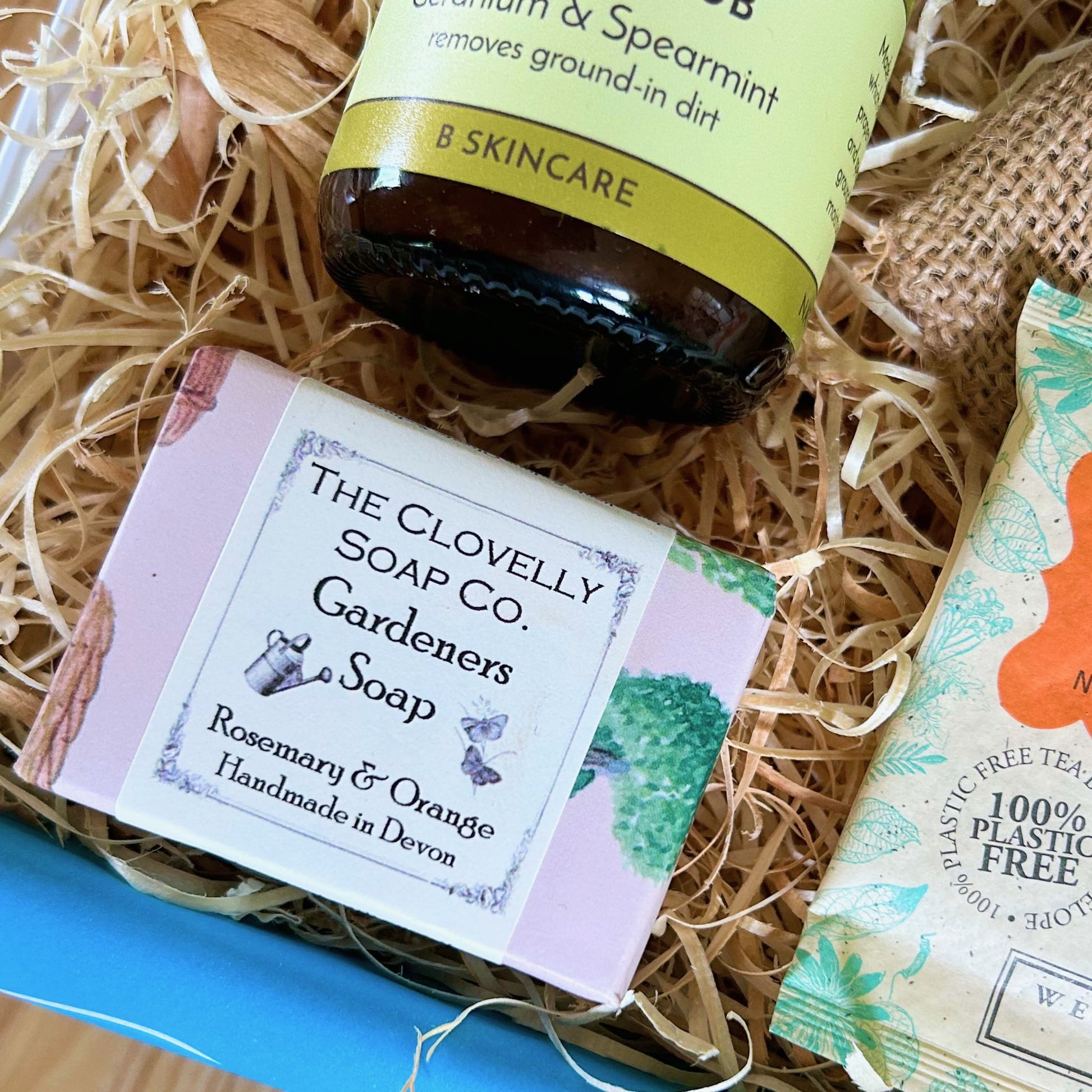 Gardener's gift  hamper with 'Gardener's Hand Scrub', 'Gardeners Soap', and 'Camomile & Elderflower' tea in a box as well as Beebombs wild flower seeds to create a wild flower meadow.