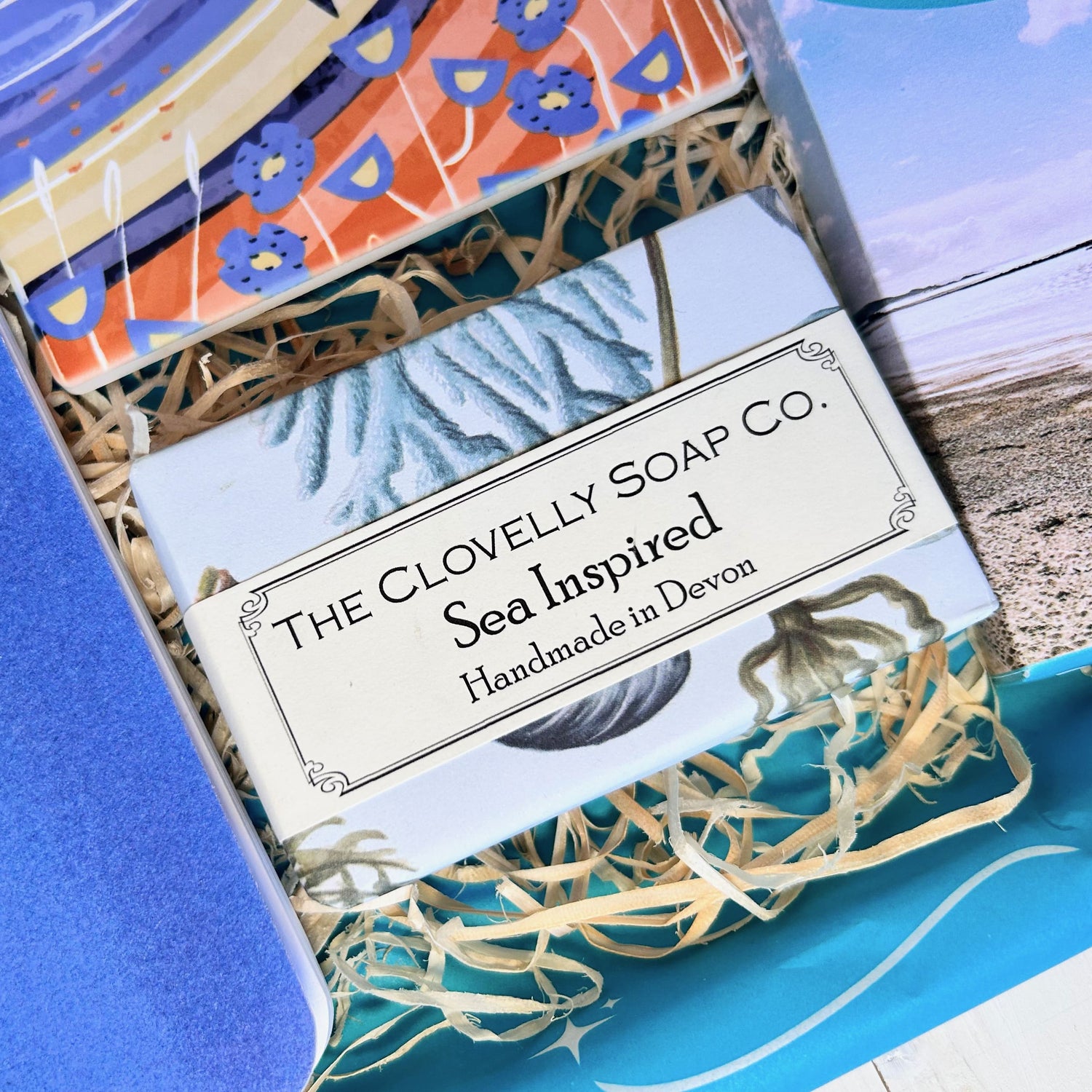 Ocean Letterbox Gift with notebook, Cornish coaster, sea inspired natural soap made in Devon, artisan Cornish chocolate and tea
