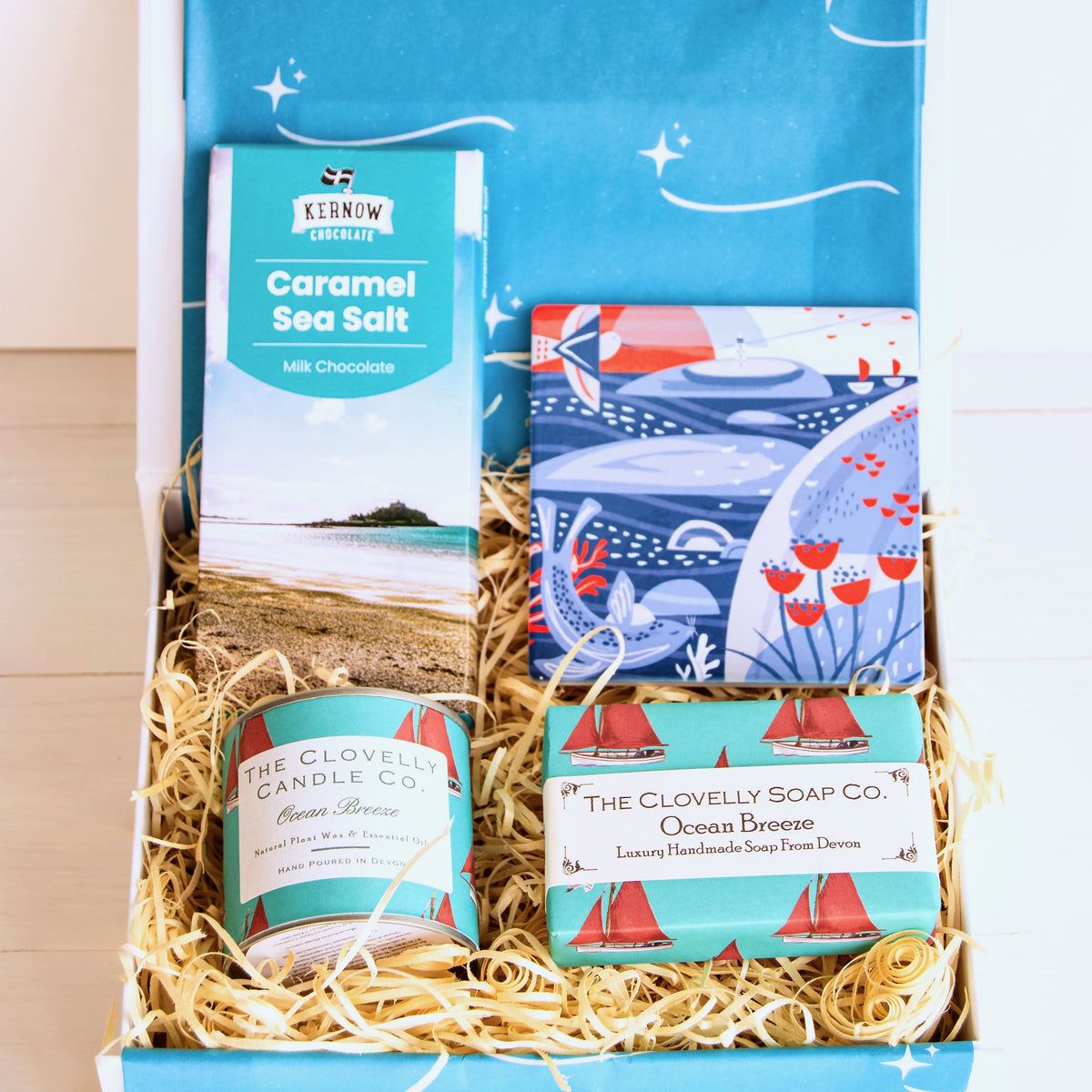 Beach Lovers Gift Set with Cornish illustrated coaster, aromatherapy ocean breeze candle, hand crafted coastal soap, sea salt chocolate.