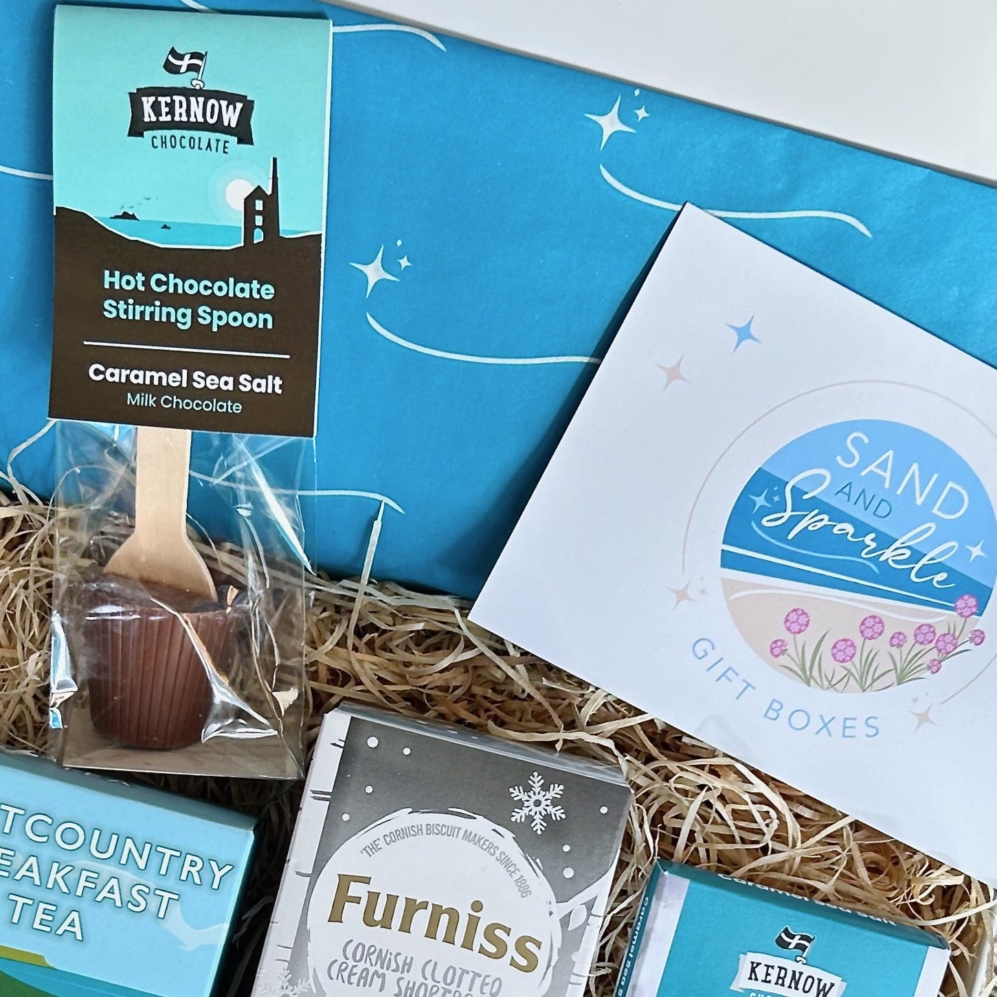 Cornish Coastal Christmas Hamper with Clotted cream shortbread, westcountry tea, luxury chocolate and hot chocolate spoon.