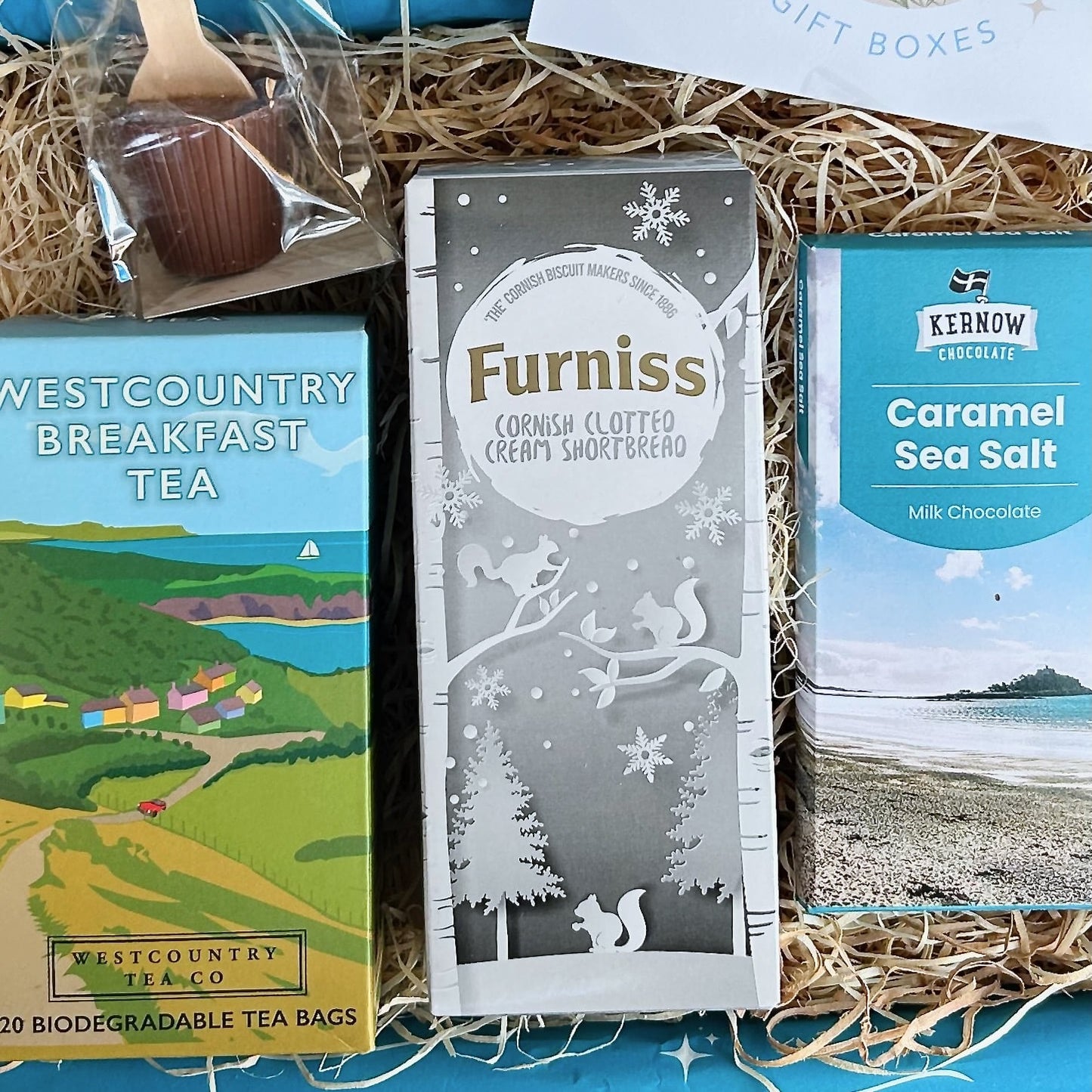 Cornish Coastal Christmas Hamper with Clotted cream shortbread, westcountry tea, luxury chocolate and hot chocolate spoon.
