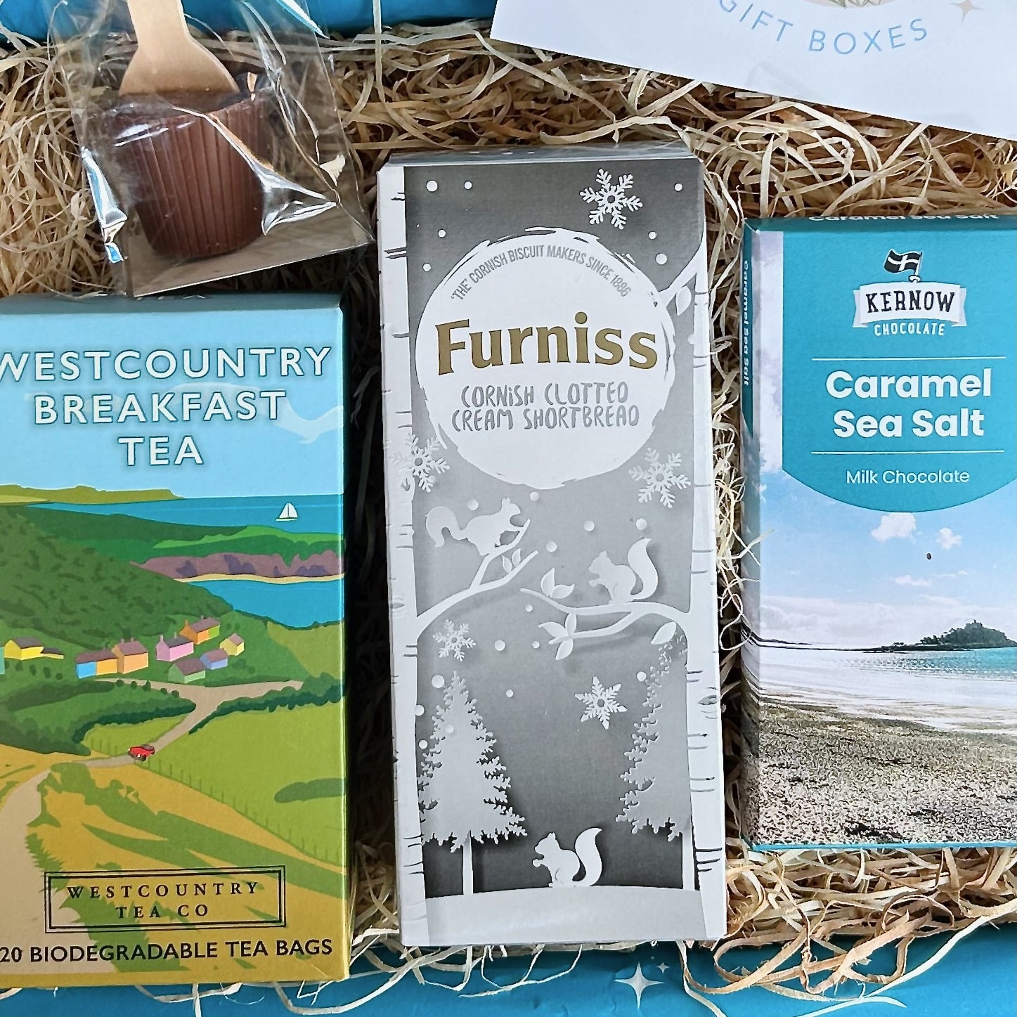 Cornish Coastal Christmas Hamper with Clotted cream shortbread, westcountry tea, luxury chocolate and hot chocolate spoon.