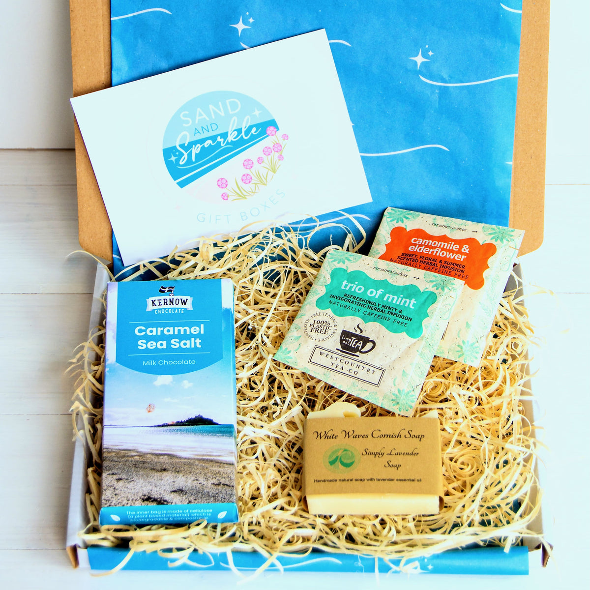Cornish letterbox gift set with White Waves Cornish Soap, artisan caramel sea salt chocolate from Kernow chocolaate and herbal tea.