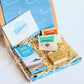 Cornish letterbox gift set with White Waves Cornish Soap, artisan caramel sea salt chocolate from Kernow chocolaate and herbal tea.