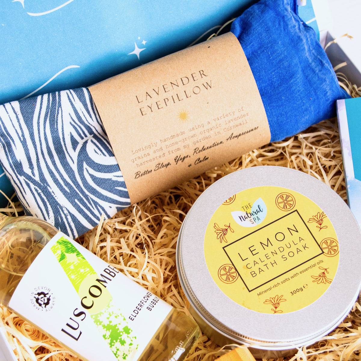 New Mum Gift Set with relaxation and pamper products including lavender eye pillow, natural bath salts, luxurious bump balm, luscombe elderflower bubbly and chocolate. 