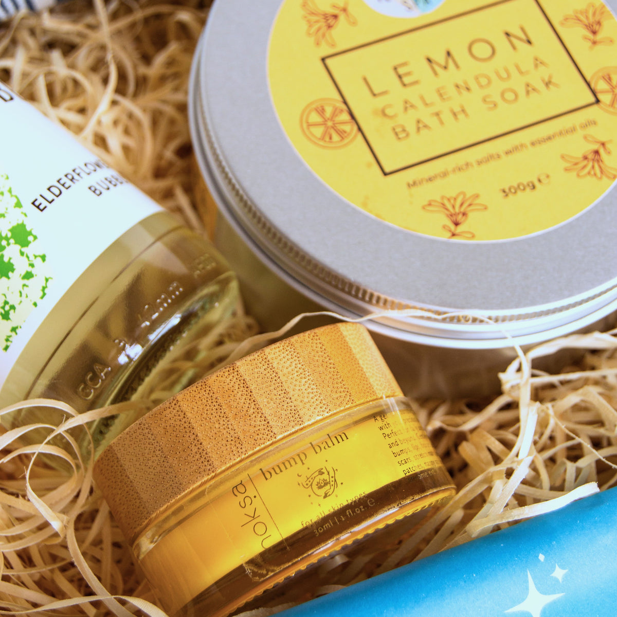 New Mum Gift Set with relaxation and pamper products including lavender eye pillow, natural bath salts, luxurious bump balm, luscombe elderflower bubbly and chocolate. 