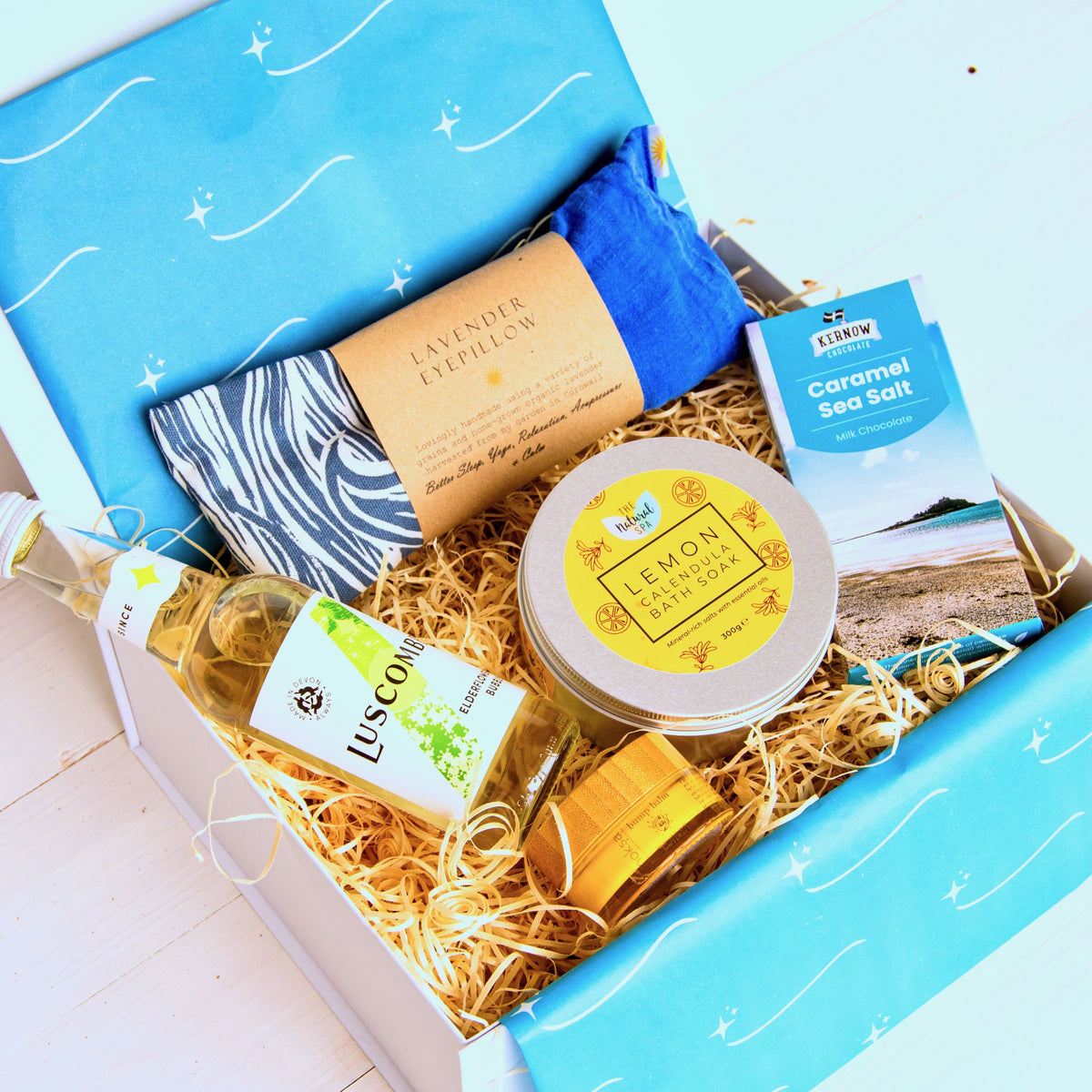 New Mum Gift Set with relaxation and pamper products including lavender eye pillow, natural bath salts, luxurious bump balm, luscombe elderflower bubbly and chocolate. 