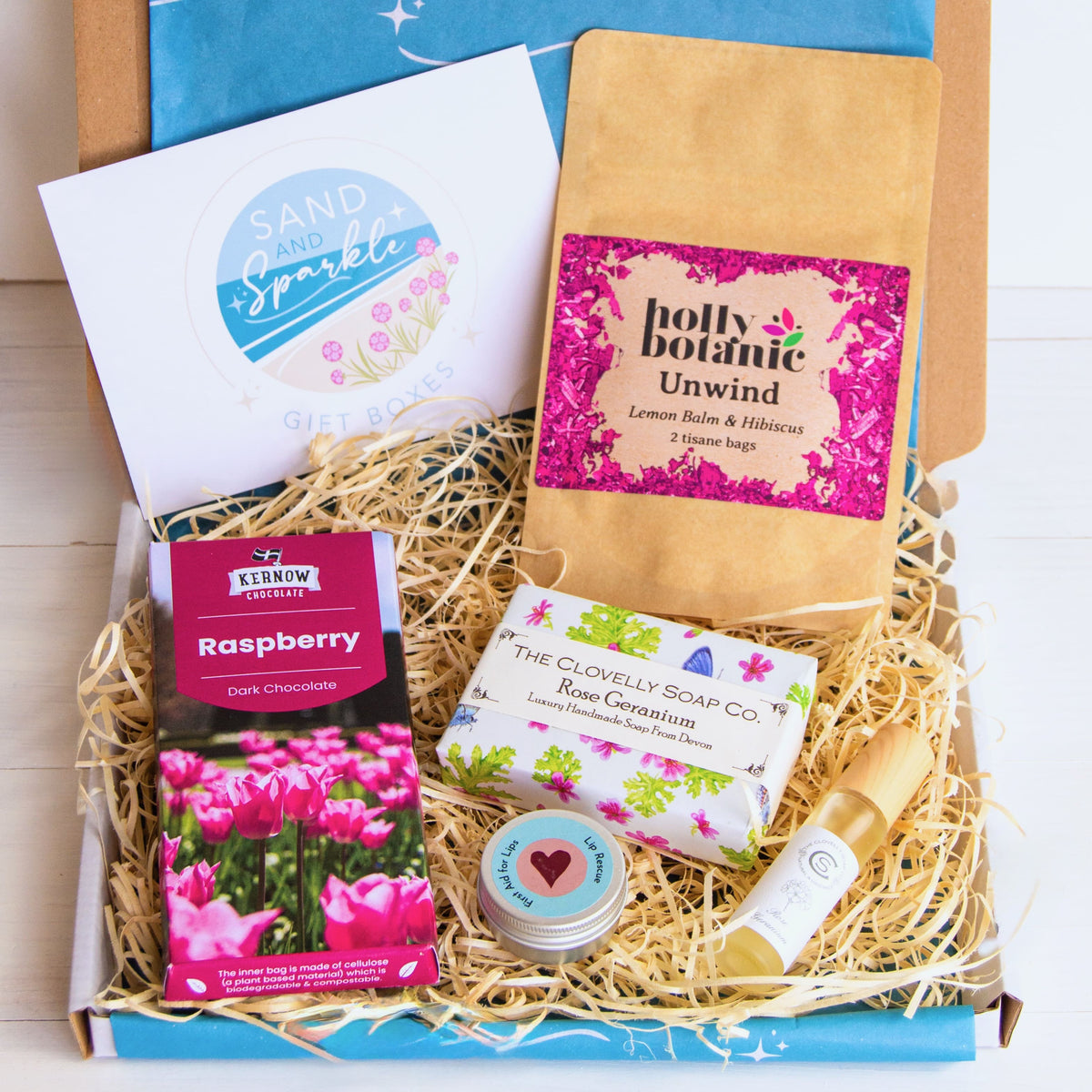 Natural Perfume Pamper Gift Set with Clovelly Soap Natural perfume, rose geranium soap, luxury lip balm and artisan raspberry dark chocolate soap and herbal tea - unwind with lemon balm and hibiscus. Made in Devon and Cornwall.