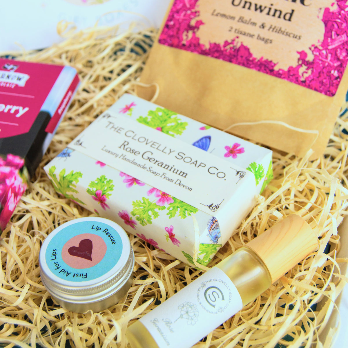 Natural Perfume Pamper Gift Set with Clovelly Soap Natural perfume, rose geranium soap, artisan raspberry dark chocolate soap and herbal tea - unwind with lemon balm and hibiscus. Made in Devon and Cornwall.