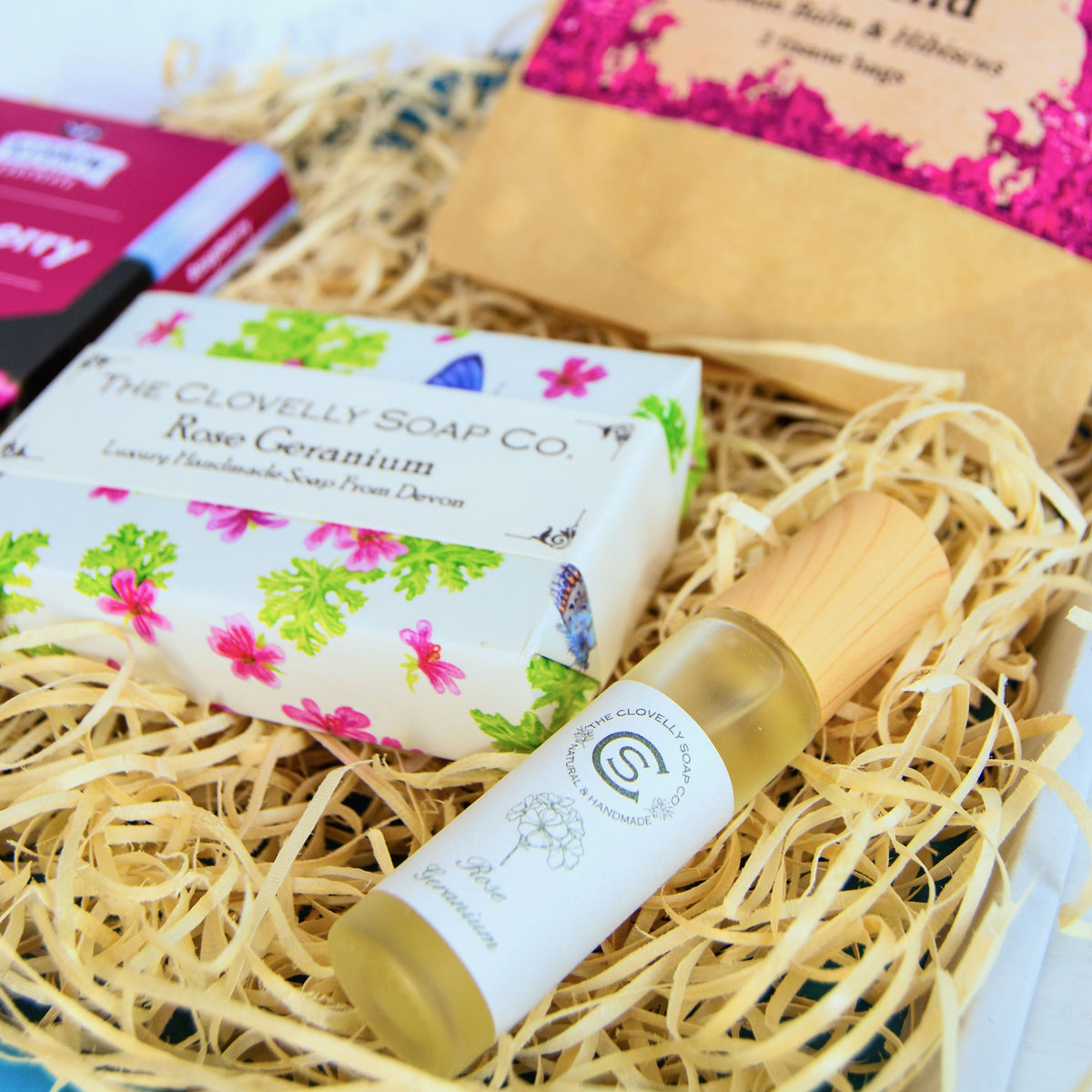 Natural Perfume Pamper Gift Set with Clovelly Soap Natural perfume, rose geranium soap, artisan raspberry dark chocolate soap and herbal tea - unwind with lemon balm and hibiscus. Made in Devon and Cornwall.