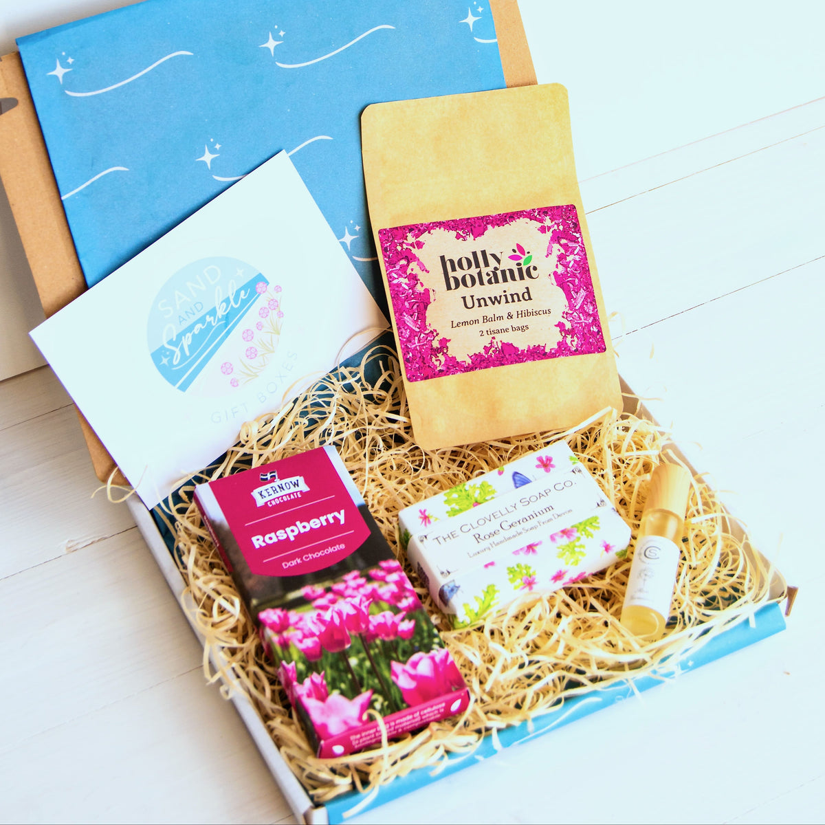 Natural Perfume Pamper Gift Set with Clovelly Soap Natural perfume, rose geranium soap, artisan raspberry dark chocolate soap and herbal tea - unwind with lemon balm and hibiscus. Made in Devon and Cornwall.