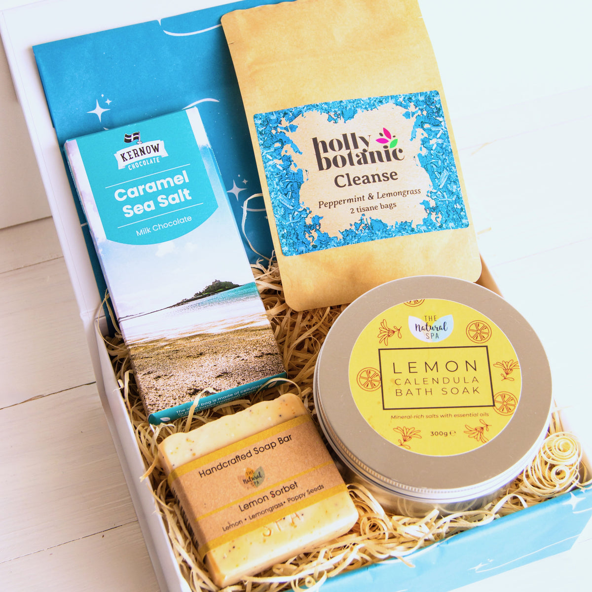 Pamper Hamper with lemon calendula bath soak, hand crafted soap, herbal peppermint and lemongrass tea and artisan Cornish chocolate.
