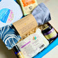 Wellbeing Gift Set with Devon and Cornish products including organic lavender eye pillow, bath bombs, hand cream, sleep oil and herbal tea in Sand and Sparkle Gift Box